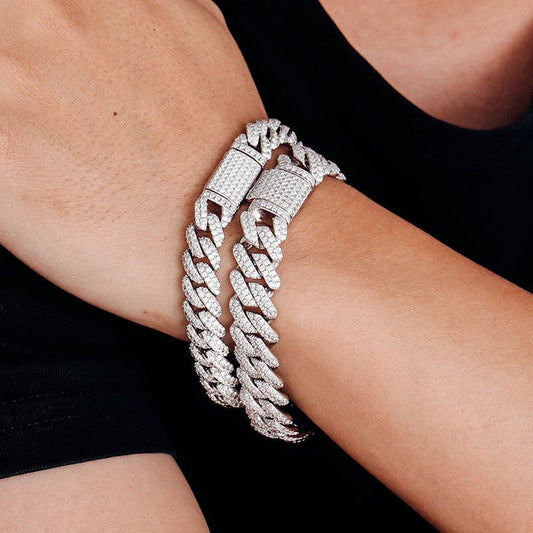 Luxury VVS1 Moissanite iced out Cuban link bracelets on a wrist, showcasing stunning diamond-like brilliance.